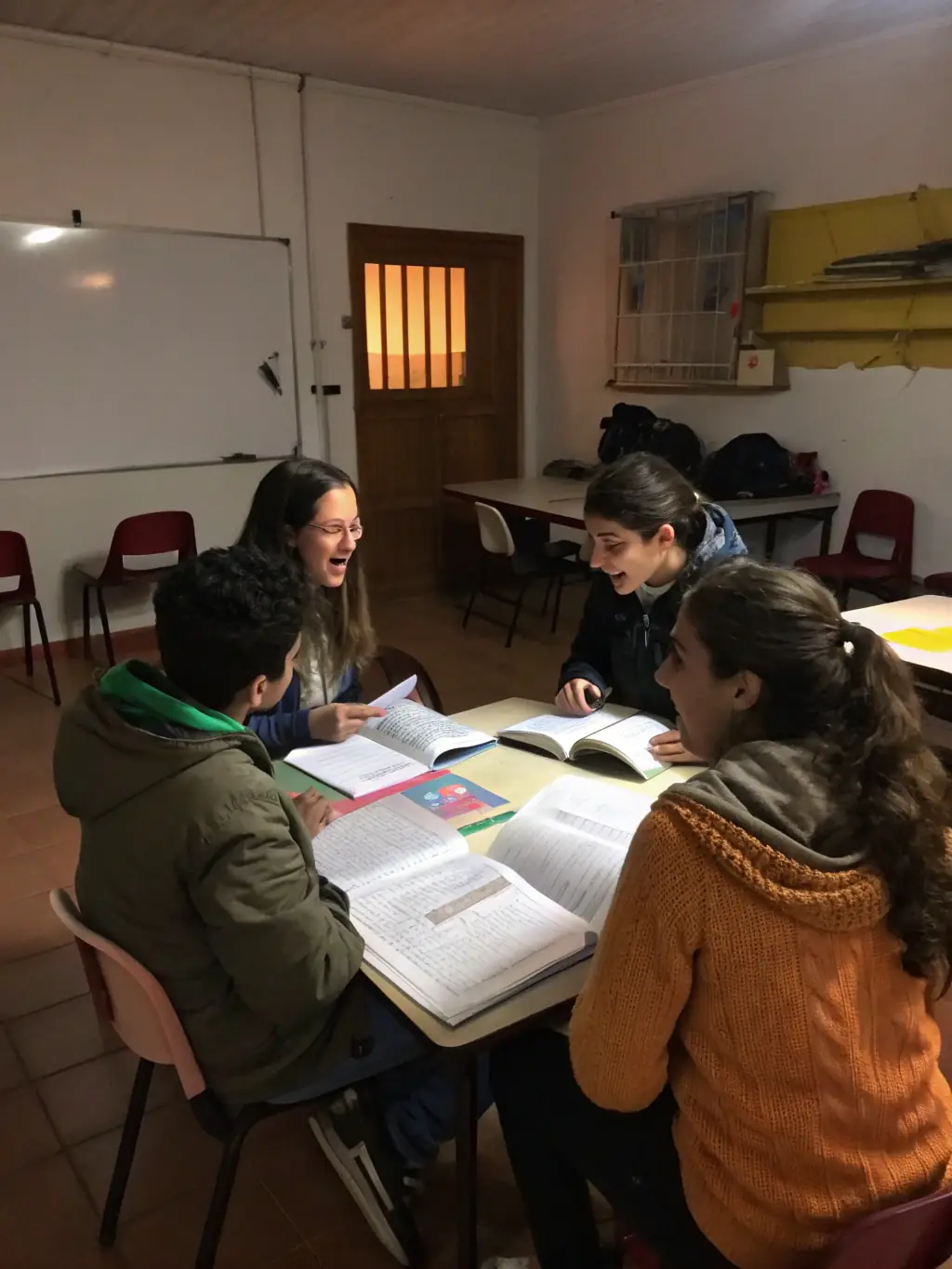 Adults in a classroom setting, actively participating in a role-playing exercise during an English lesson at Play and Learn. The atmosphere is supportive and encouraging.